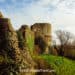 The impressive ruins of Pevensey Castle dominate the landscape.