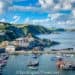 cornwall coastline with fishing boats and village