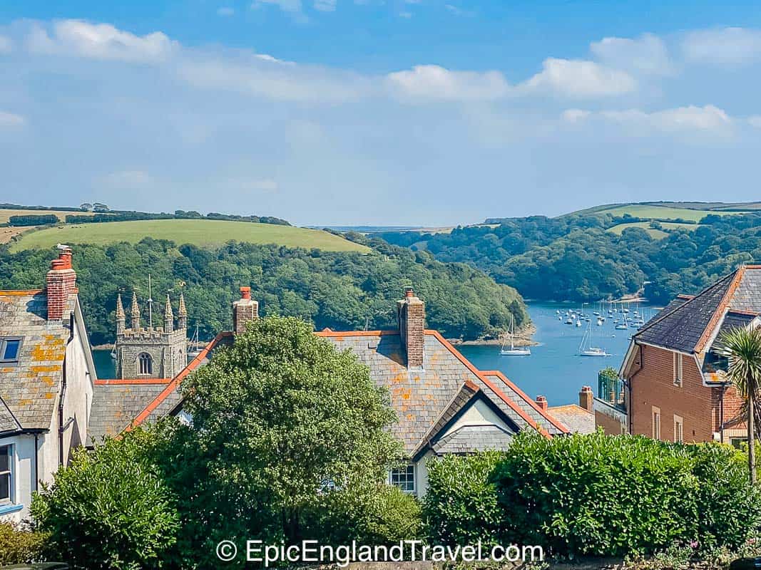 the rooftops of Fowey with a view of the estuary and rolling hills